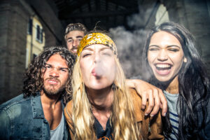 Group of friends enjoying smoking cannabis