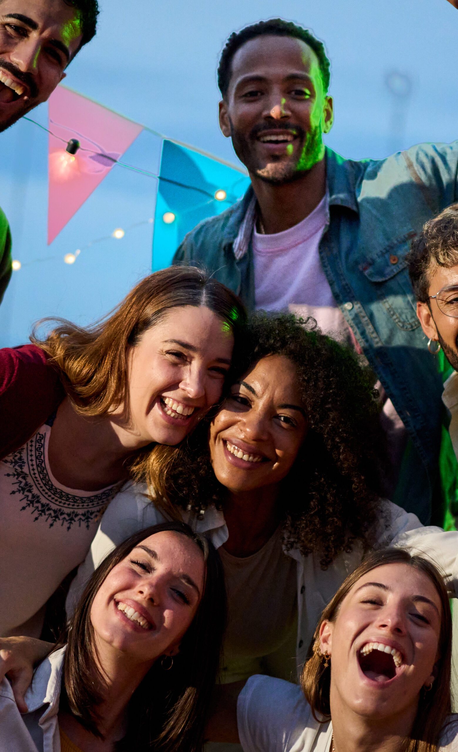 Portrait image of happy young people gathered together and smiling into the camera